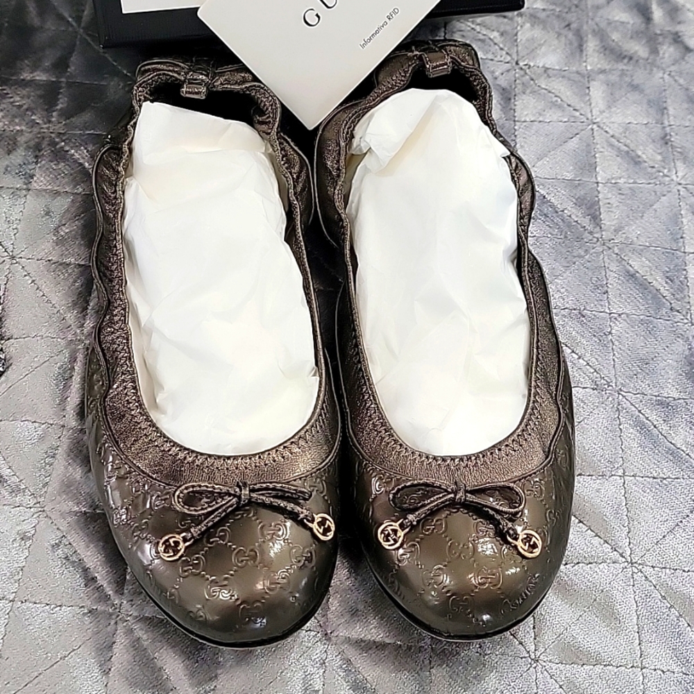 Authentic Gucci ballet flats...pewter color. So cute!! Just too big for me!